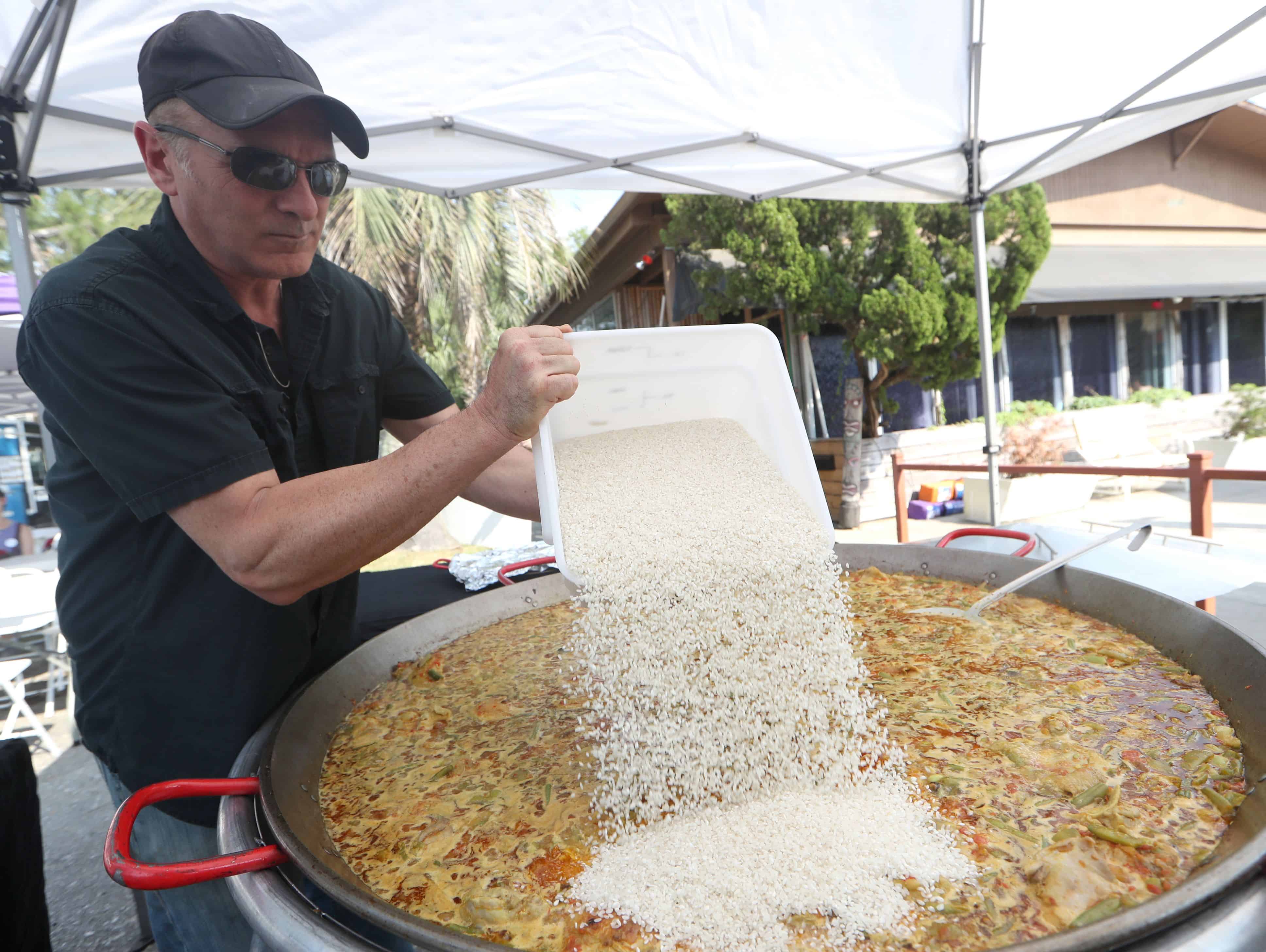 Juan from Real Paella Catering preparing paella