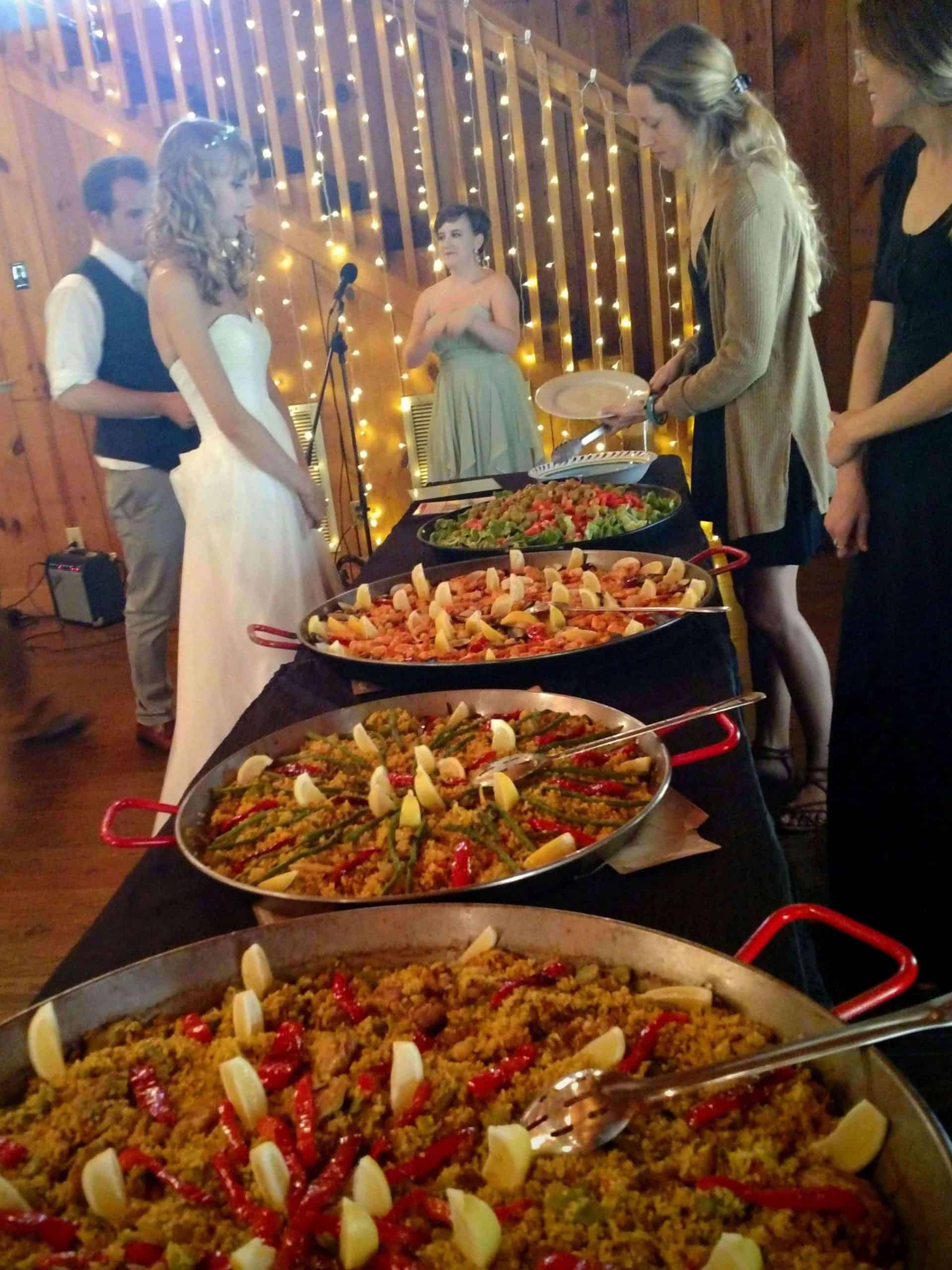 Serving paella at wedding