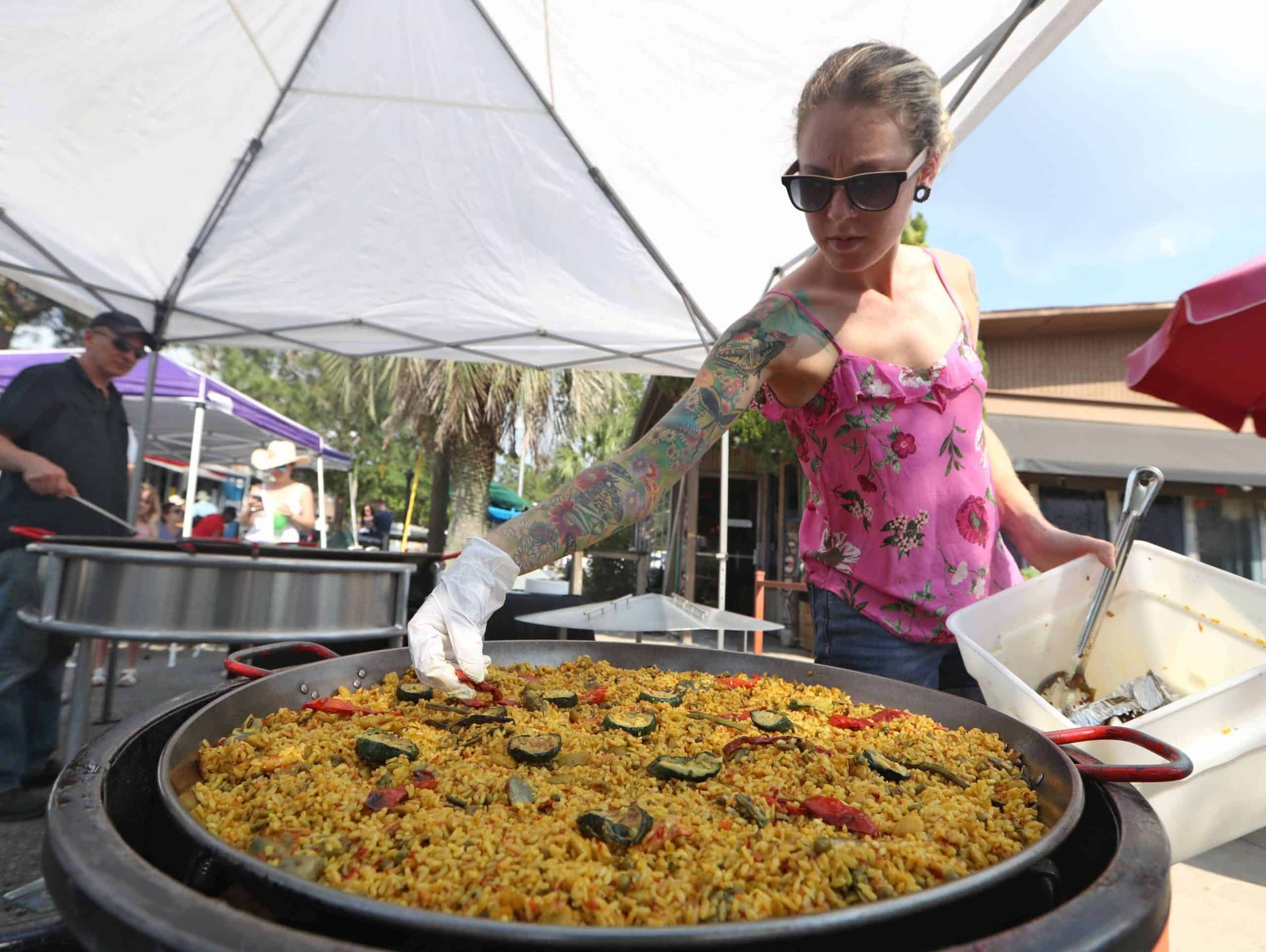Zoe Allaire of Real Paella Catering prepares a vegan version of the Spanish dish during the fourth annual Tallahassee Taloofa Fest on Saturday, May 12, 2018