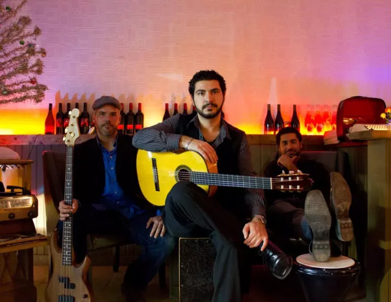 Spanish guitar trio performing at a catered event