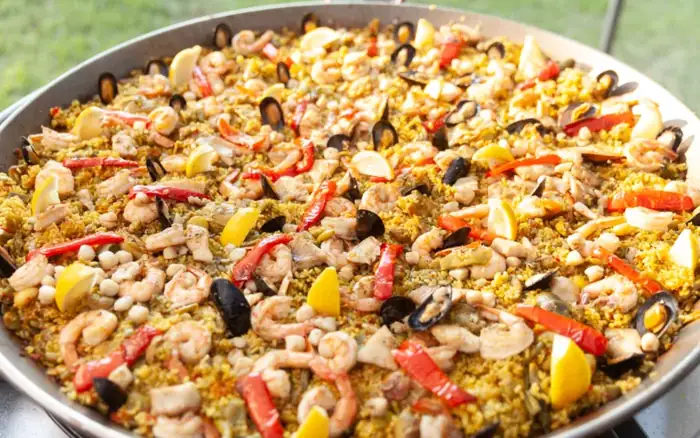 Paella being served at a wedding